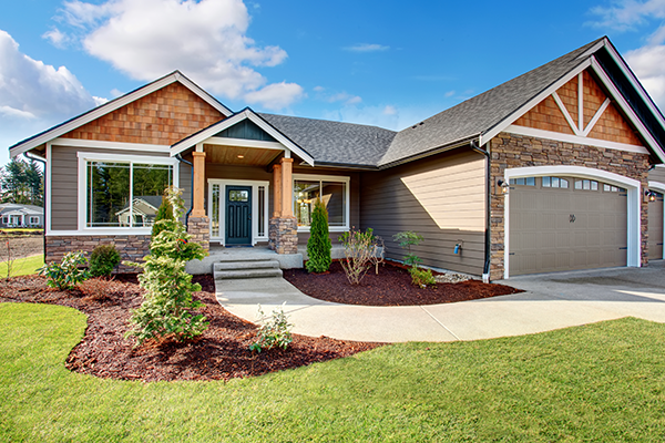 beauty shot of a residential home with a well manicured lawn and lanscaping